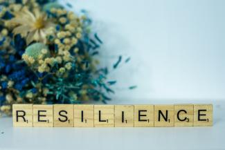 a scrabble type block spelling the word resilince by Alex Shute courtesy of Unsplash.
