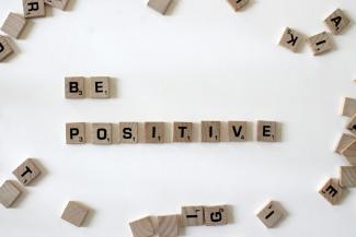 be positive scrabble pieces by Amanda Jones courtesy of Unsplash.