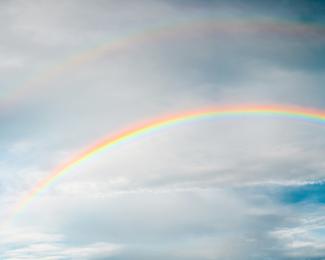 rainbow under cloudy sky during daytime by Taeshin T. courtesy of Unsplash.