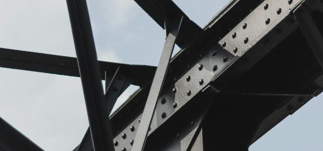 black metal frame under blue sky during daytime by Joshua Tsu courtesy of Unsplash.