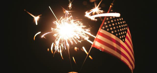 time lapse photography of sparkler and U.S.A flag let by Stephanie McCabe courtesy of Unsplash.
