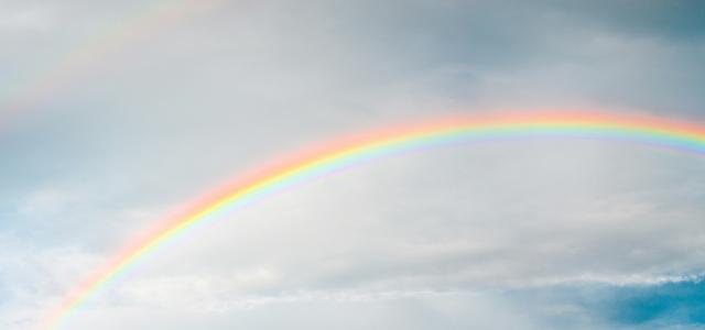 rainbow under cloudy sky during daytime by Taeshin T. courtesy of Unsplash.